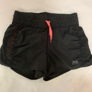 Black athletic shorts with pink spandex attached underneath. Size small